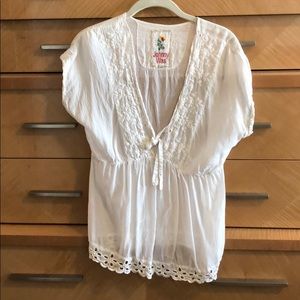 Sheer white blouse with lace trim